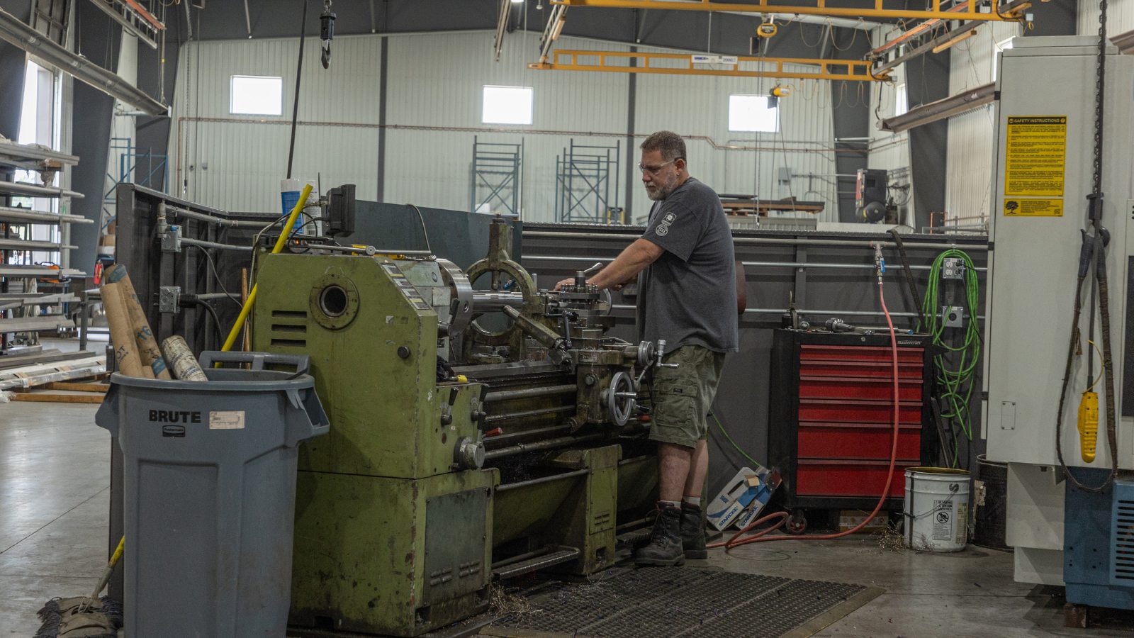 Dynamic Millwrights Inc. worker with machine